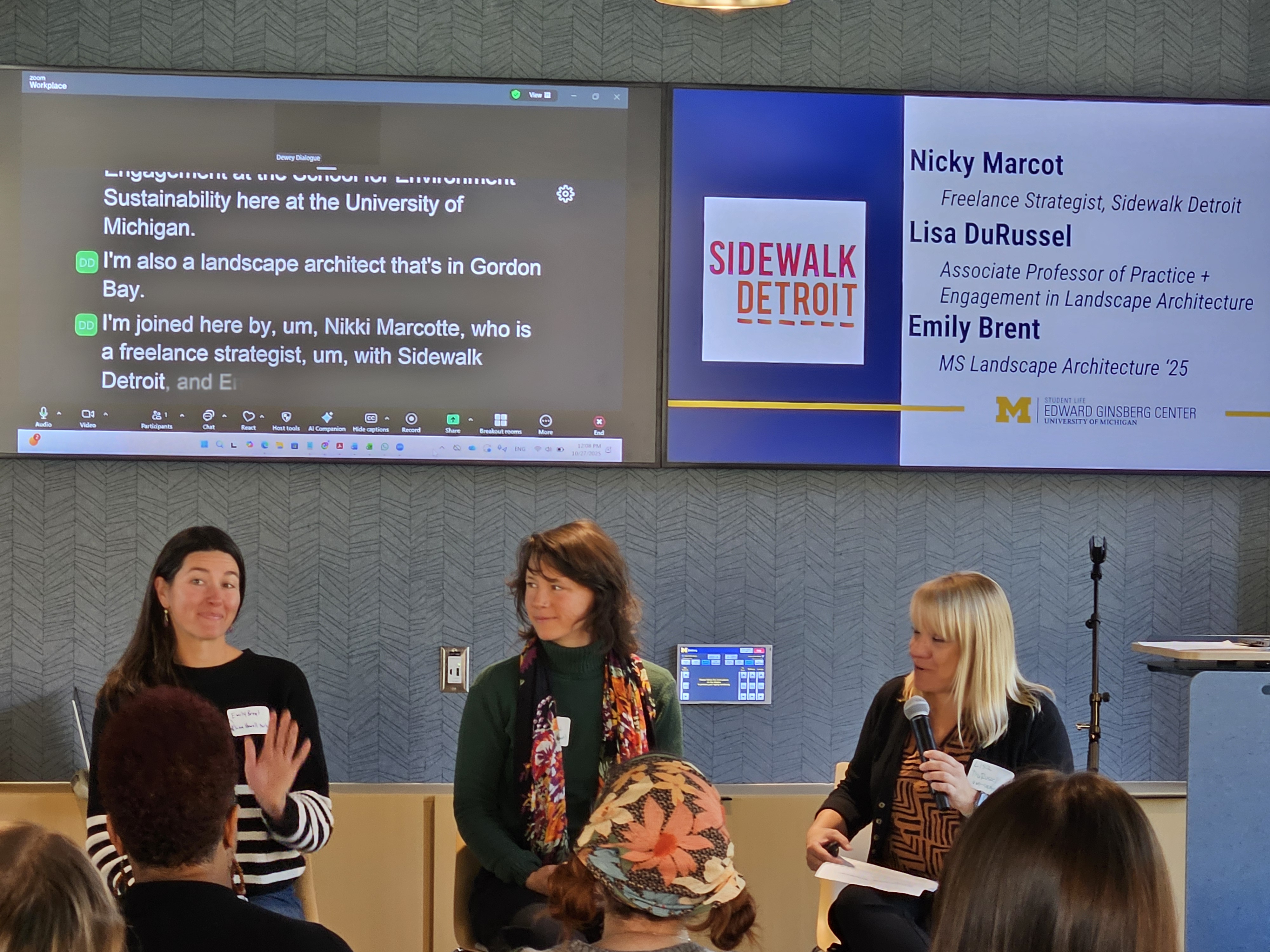 Emily, Nicky and Lisa sitting on chairs beneath screen with Sidewalk Detroit logo and captions playing