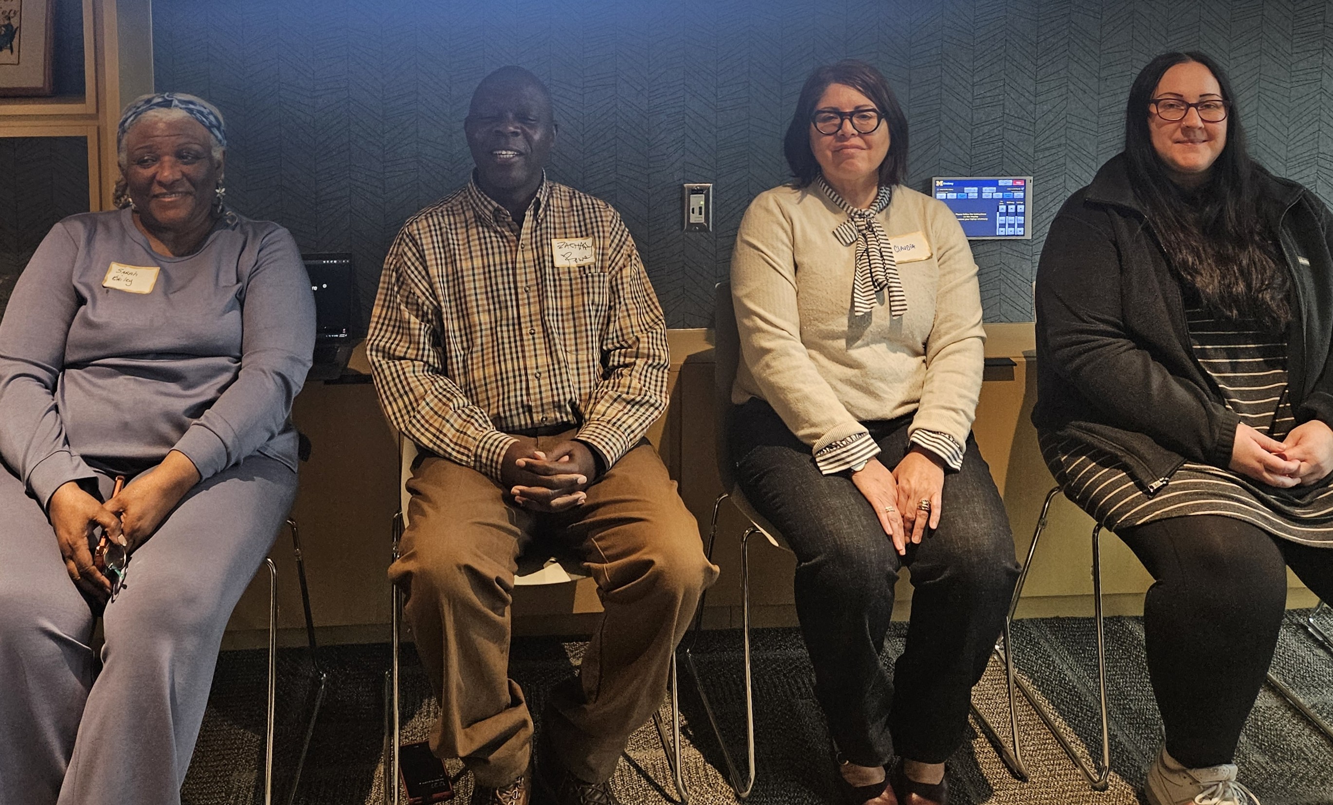 four seated people: Sarah Bailey of Bridges into the Future, Zachary Rowe from Friends of Parkside,Claudia Diaz-Byrd from U-M Ann Arbor,Molly Manley from UM-Dearborn,