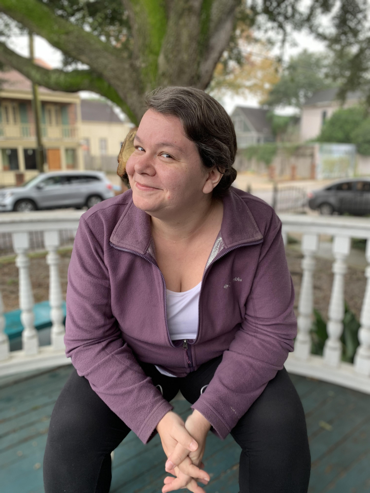 A photo of Jess Letaw sitting and smiling at the camera.