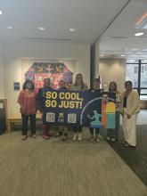 Photos of Ginsberg Center and Social Work Staff behind So Cool So Just Sign
