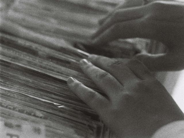 hand sorts through files