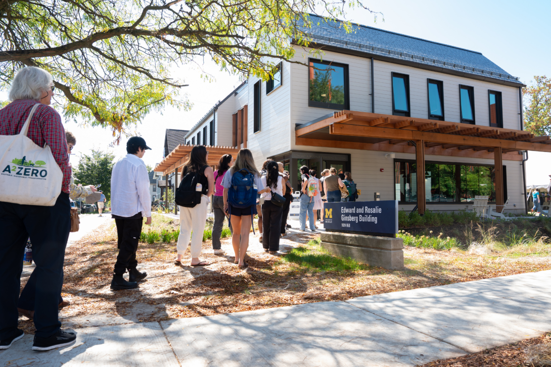 Photos of people lined out to attend Ginsberg Center Open House